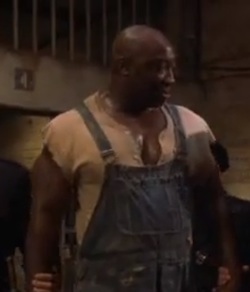 Still from "The Green Mile", showing John Coffey (Michael Clarke Duncan) being led from his cell to his execution