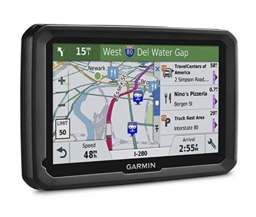 A picture of a Garmin Dezl 580 sat-nav with a map of an American city shown, with a list of two truck stops and a pizzeria on the right.