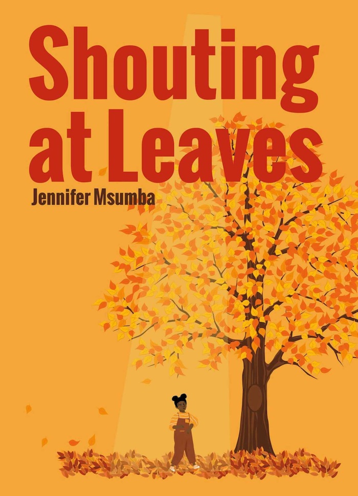 The cover of Shouting at Leaves by Jennifer Msumba, showing a tree with yellow and red leaves falling on the ground, and a young Black girl in brown dungarees over a red and yellow striped T-shirt is standing next to it amid the fallen leaves. This is on an orange background. The title and author's name are at the top.