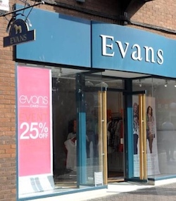 A shop front with the name "Evans" in white over a dark green background; there are some posters showing off the clothing in the window, which is dominated by a large sign saying "Evans card: 25% off". The shop is set against red brickwork.