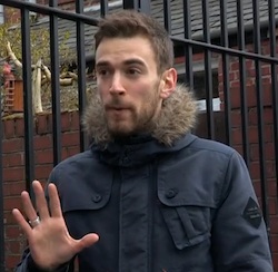 Picture of Jonny Benjamin, a white man with stubble in a thick blue jacket with a furry collar