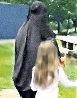 A picture of a Muslim woman in a black robe and face covering and a white girl with long blonde hair, wearing a white T-shirt and black trousers or skirt. The girl's hair is blurred.