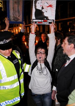 Picture of woman holding up abortion rights banner in London