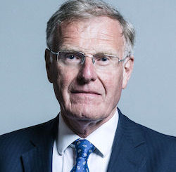 Picture of Christopher Chope, a white man in late middle age wearing glasses with thin metal rims, a white shirt, a blue tie and a dark grey jacket.