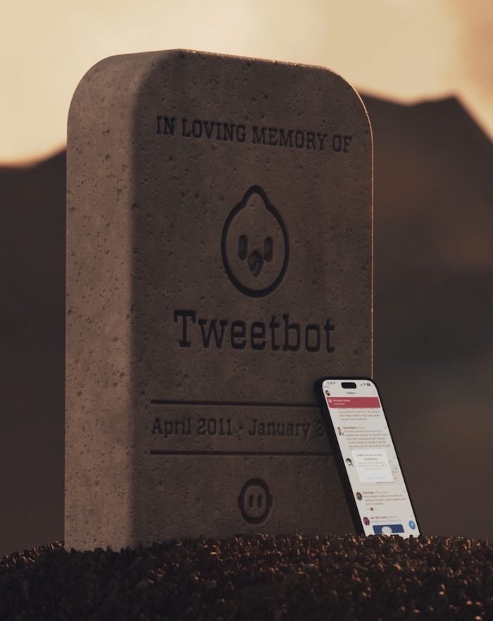 A 'gravestone' with the words "In loving memory of Tweetbot, April 2011 - January 2023" with two Tweetbot logos. Up against it is an iPhone with Tweetbot running.