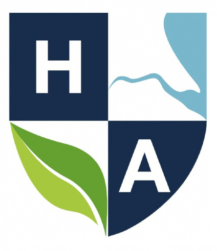The logo of Holderness Academy, a shield with H and A in top left and bottom right corners respectively, a map of the Humber estuary and Humberside coastline in the top right corner, and a leaf in the bottom left.